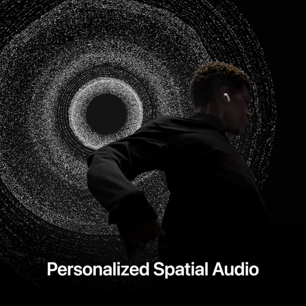 Amidst a swirling, abstract black and white background, a person wears earbuds with "Personalized Spatial Audio" text—showcasing the incredible upgrade in AirPods Pro 2 design.